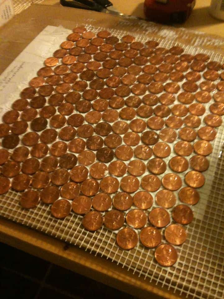 pennies installed onto mesh backing