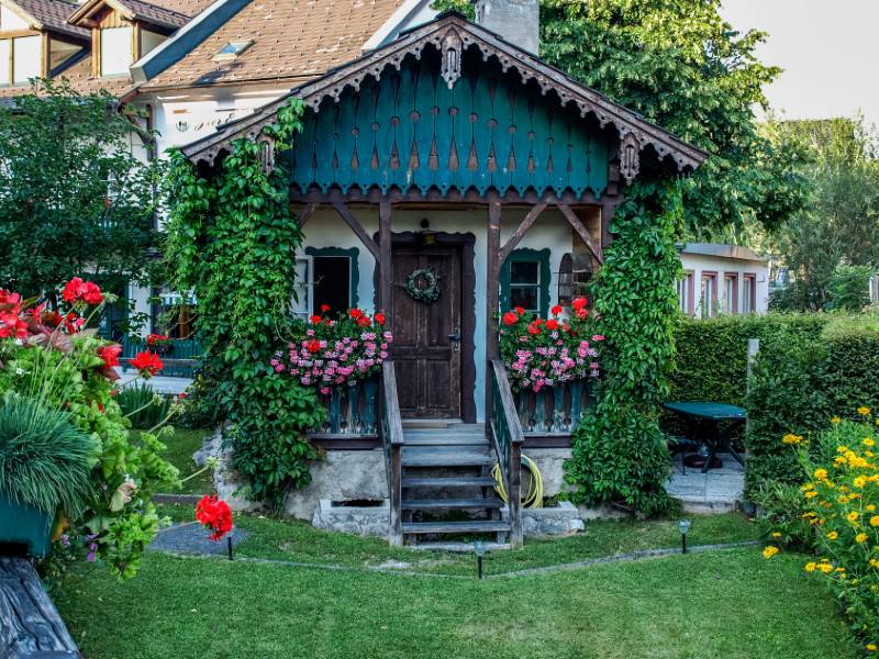 cottage with cottage style landscaping