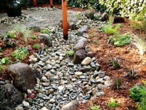 Create a dry creek bed french drain