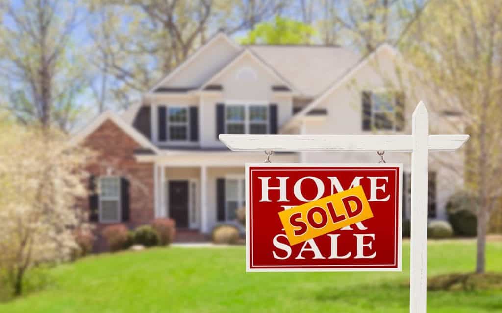 home with a sold sign in front