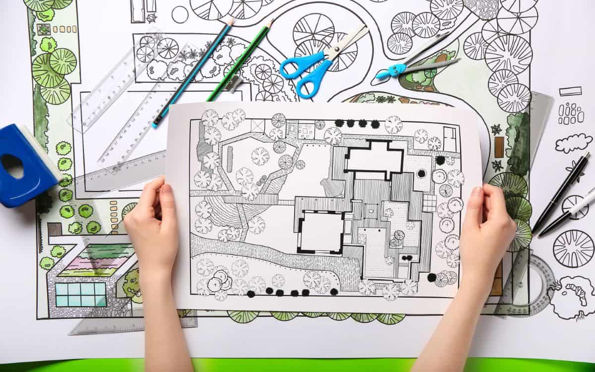 landscape designer with design plans