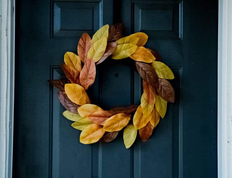 Yellow leaved wreath on navy door